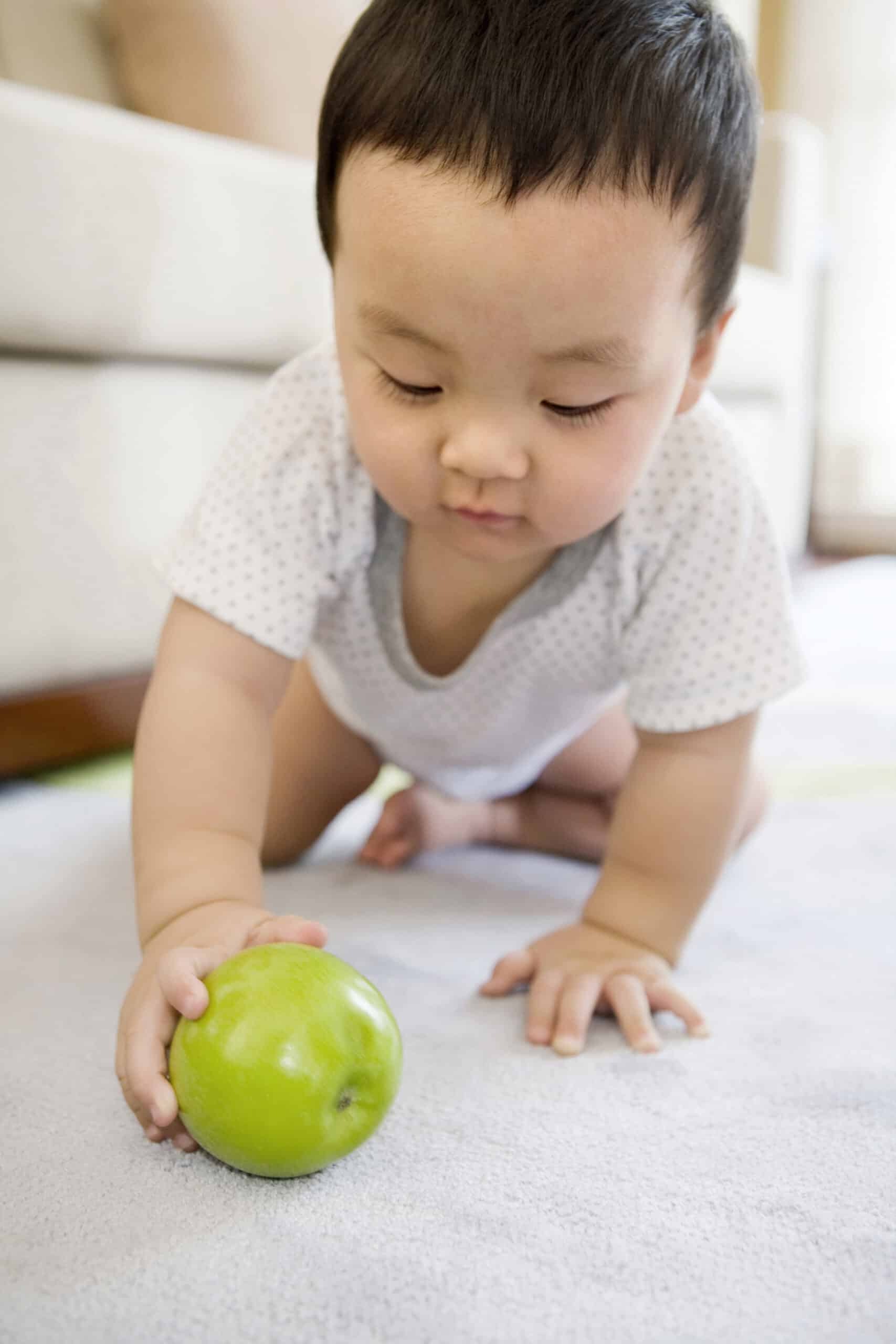 infant with fruit